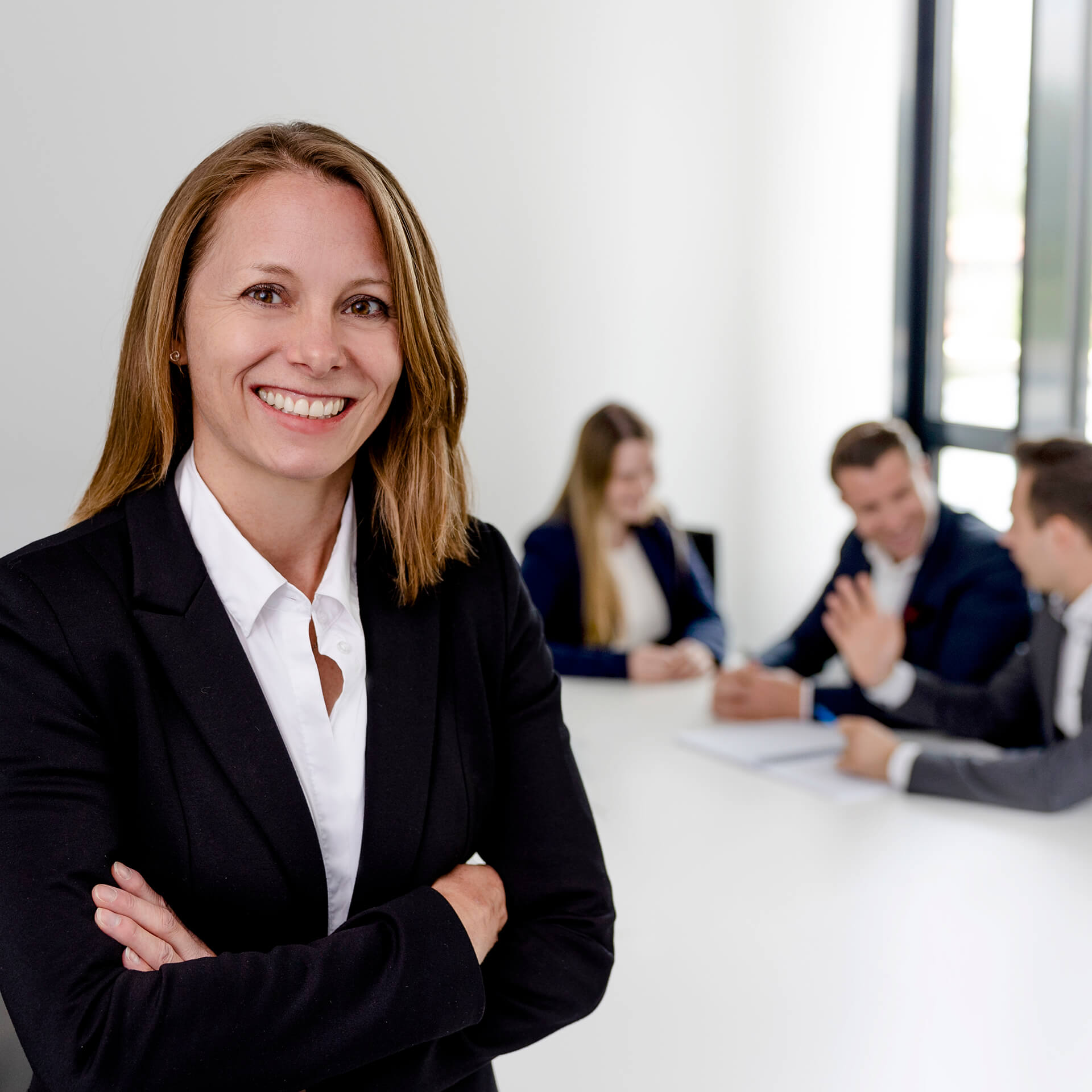 A lawyer from activeMind.legal stands in front of her data protection team at the law firm